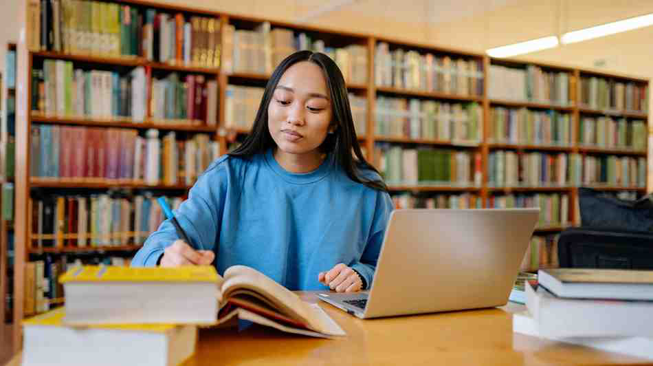 A medical school student studying for her Step 1 exam in a library.
